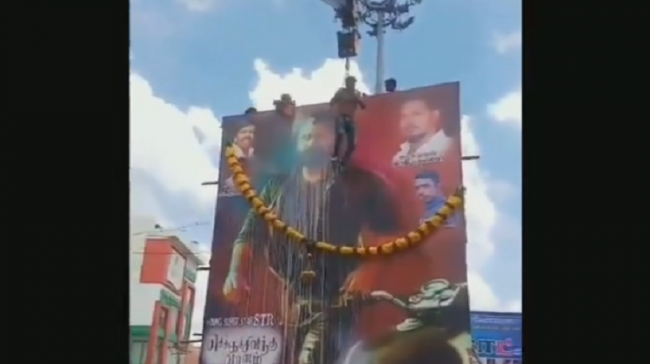 Fan Hangs From Crane To Show Love For pawan kalyan